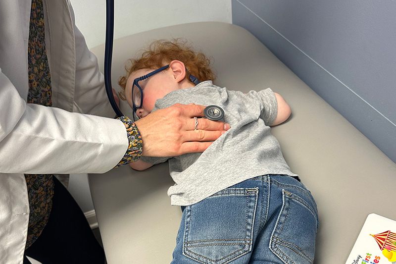 sick child receiving an examination